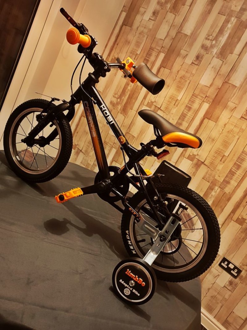 Other image for Dad encourages children to get on their bikes...
